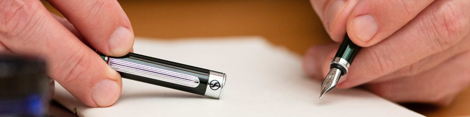 Close caption of a luxury fountain pen by Scriveiner in a hand